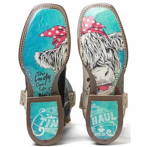 Women's Tin Haul Shaggy Spot Boots with turquoise leather soles, brown trim, white shaggy spots, and colorful cowgirl artwork