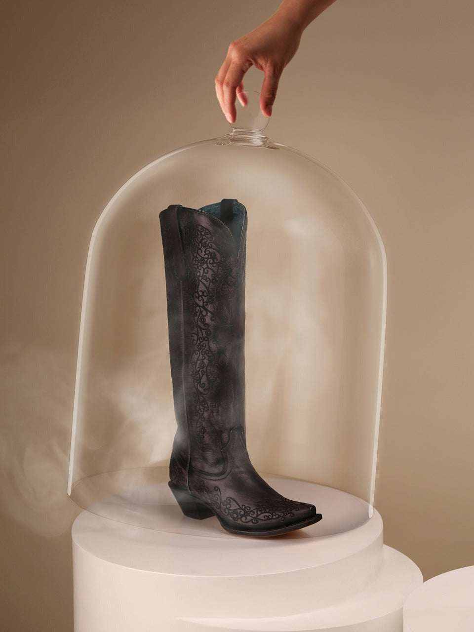 Women's Corral Black Genuine Leather Boots feature black leather, subtle tonal floral embroidery, a tall shaft and snip toe