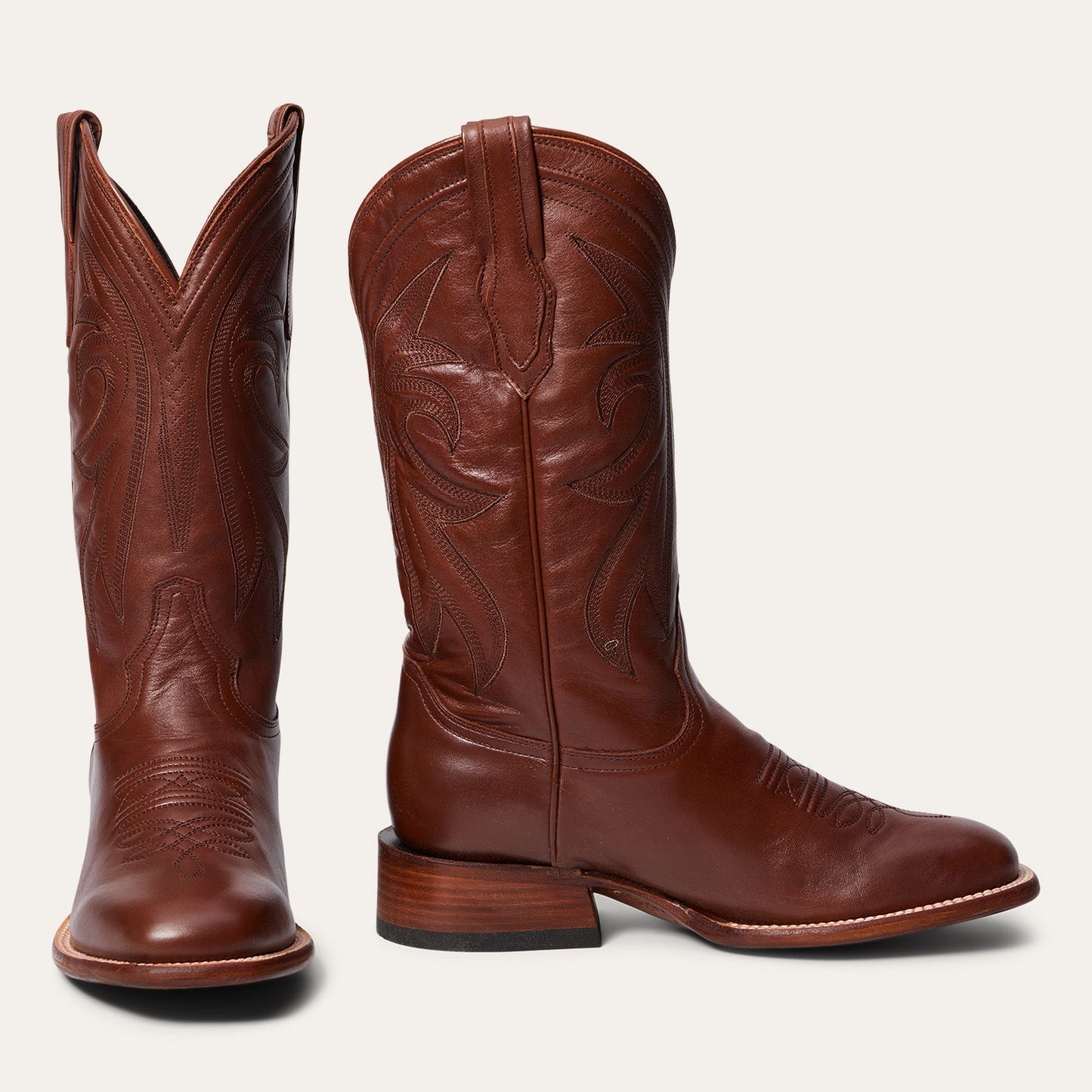 The Mens Stetson Grange Leather Boot from the JBS Collection features brown leather, handcrafting, decorative stitching, a square toe, pull straps, and a stacked heel—American style from Stetson Boots shown on a white background.