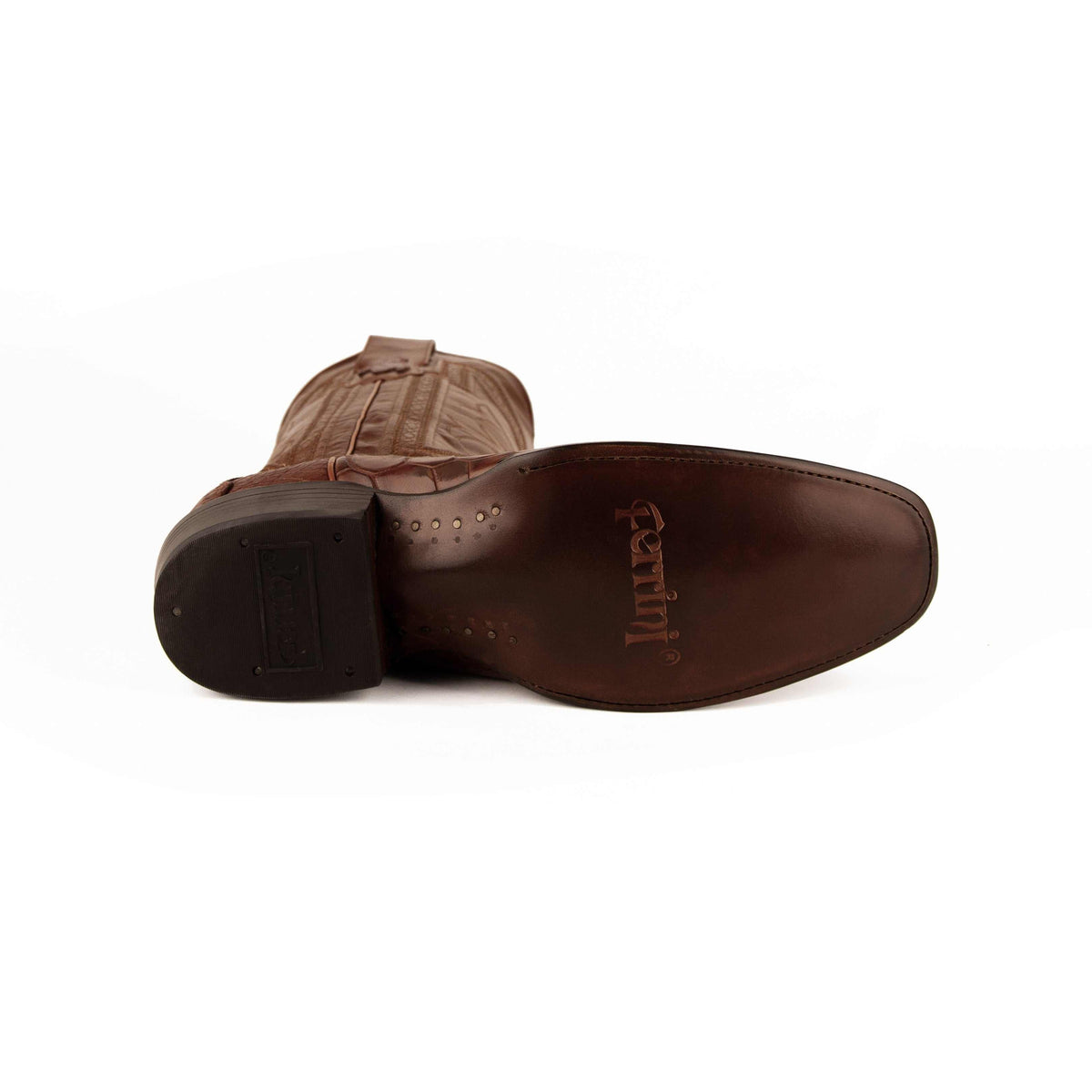 Ferrini Stallion Alligator Belly Boots in cognac brown leather, showing a smooth branded outsole and textured alligator belly vamp