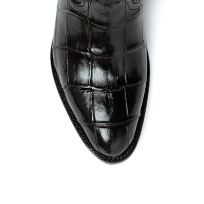 Men's Ferrini Stallion boot toe in glossy black alligator belly leather, showing distinctive rectangular scale pattern