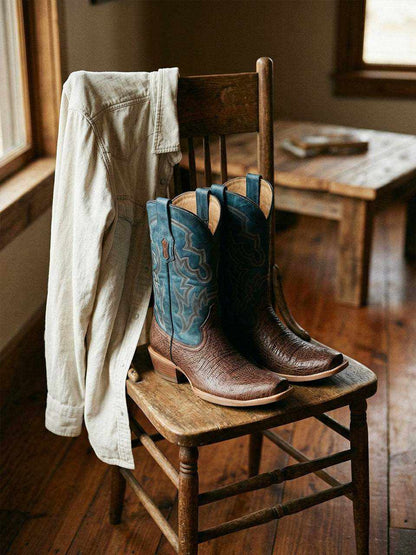 Men's Corral Brown Ostrich Boots featuring brown ostrich leather foot and 12.5 inch blue shaft with navy-blue embroidery and narrow square toe