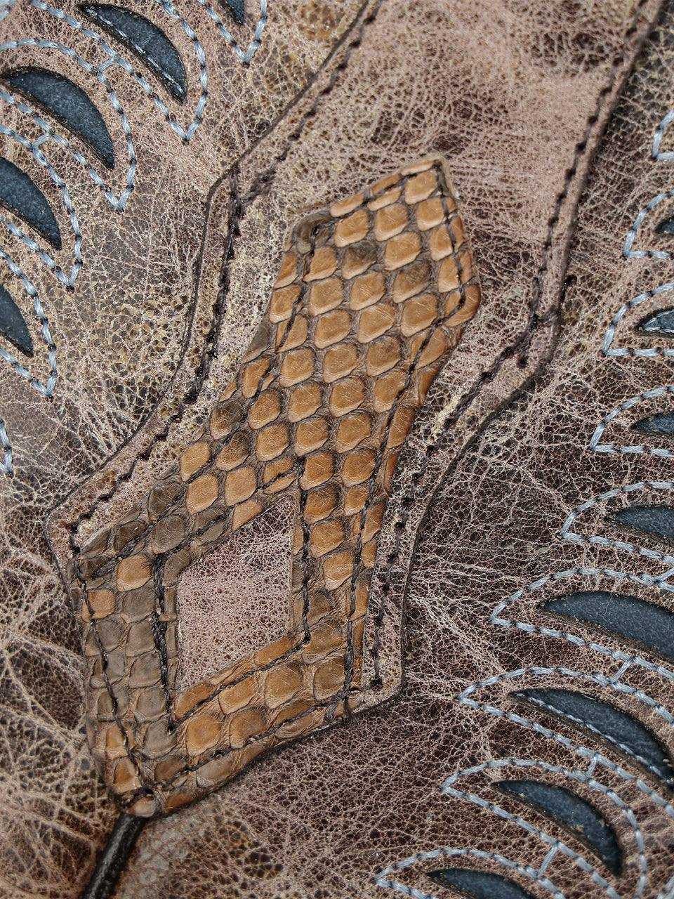 Close-up of Men's Corral Honey Genuine Python Boots with Inlay & Embroidery showing honey python leather inlay and detailed blue embroidery on textured brown boot