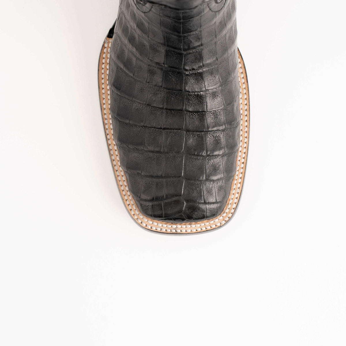 Men's Ferrini Dakota boot toe in black caiman belly leather with distinctive rectangular scale pattern and stitched edge