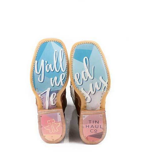 Women's Tin Haul Boots with colorful blue and pink outsole, tan leather trim, and bold white script lettering