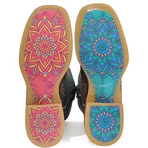 Women's Tin Haul Boots with bright pink and turquoise mandala-patterned soles, tan leather edges and stacked heels