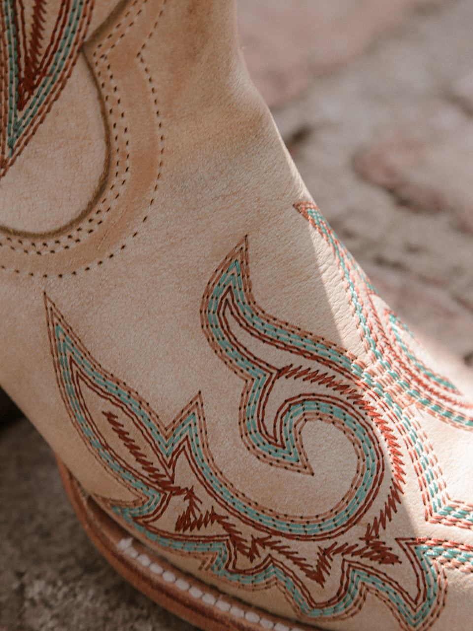 Women's Corral Bone Genuine Leather Boots with Embroidery in bone color featuring intricate red and blue stitched patterns on soft leather
