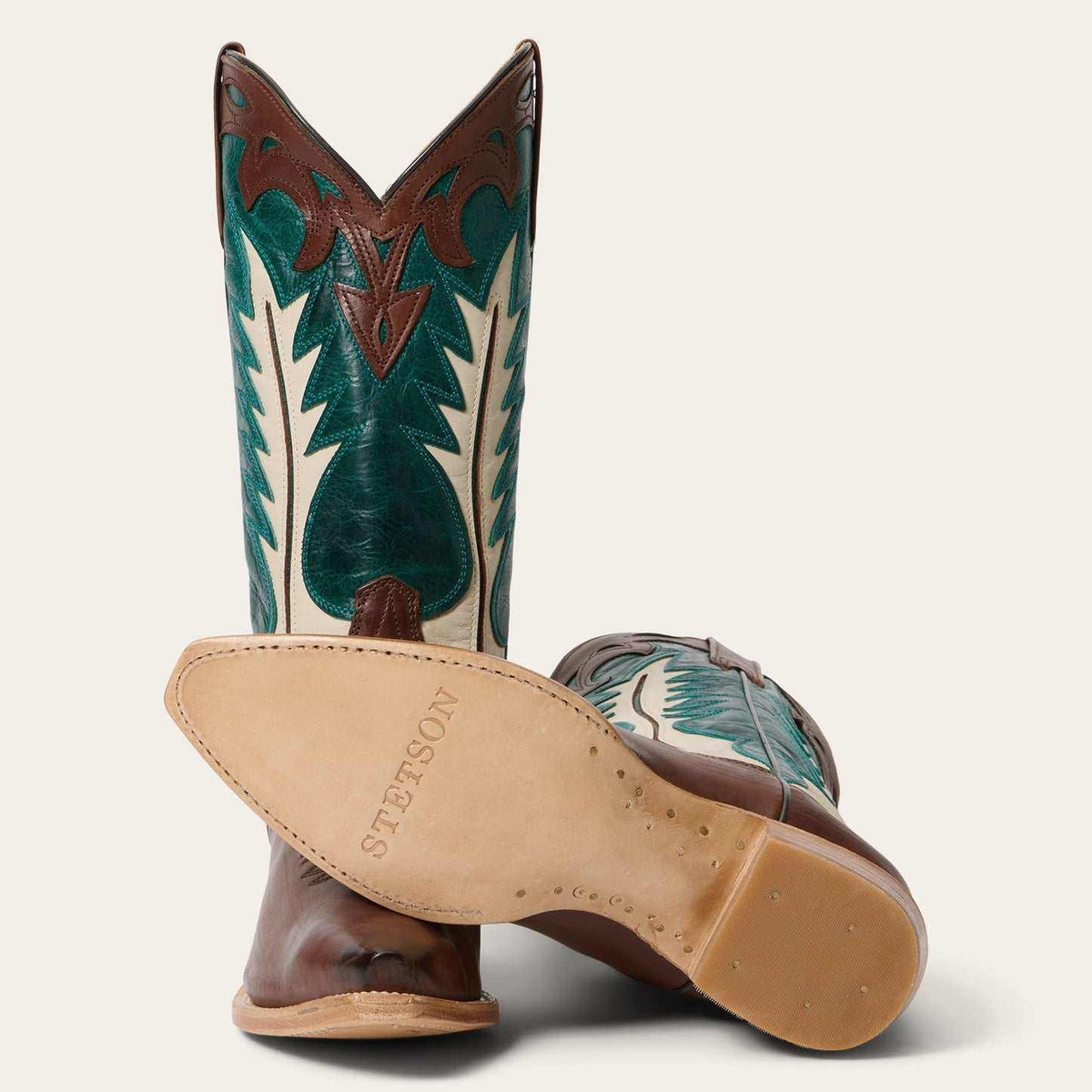 Handcrafted brown women's Stetson Dani boots with turquoise shaft and cream flame inlay