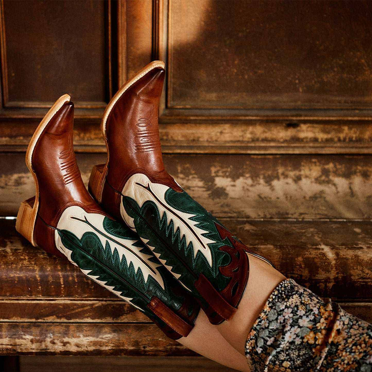 Handcrafted brown women's Stetson Dani cowboy boots with turquoise flame inlay