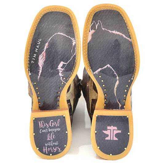 Women's Tin Haul Boots with dark soles, tan edging, pink horse artwork and a horse-themed message on the heel